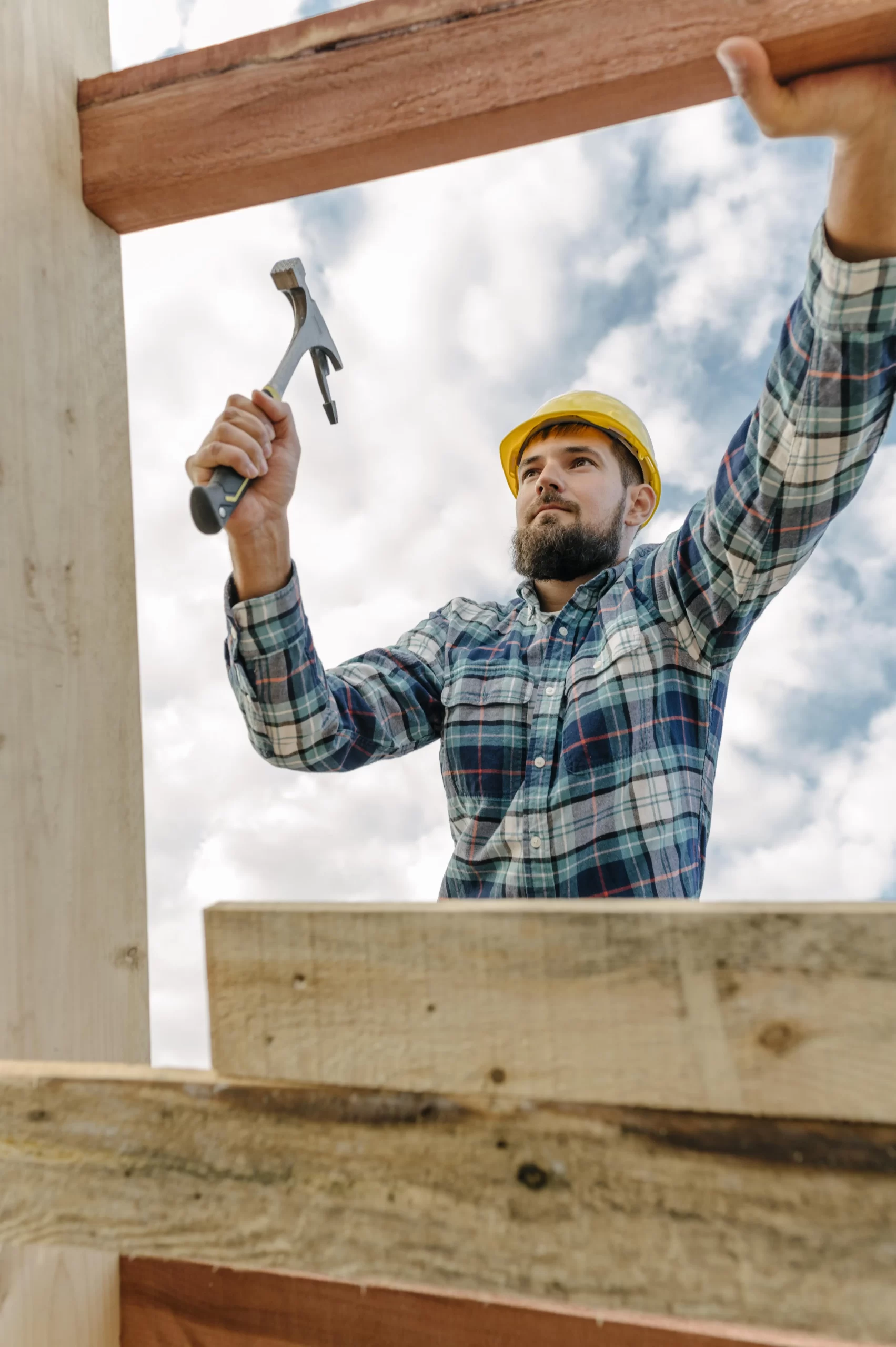 construction-worker-with-hammer-hard-hat-building-roof-house